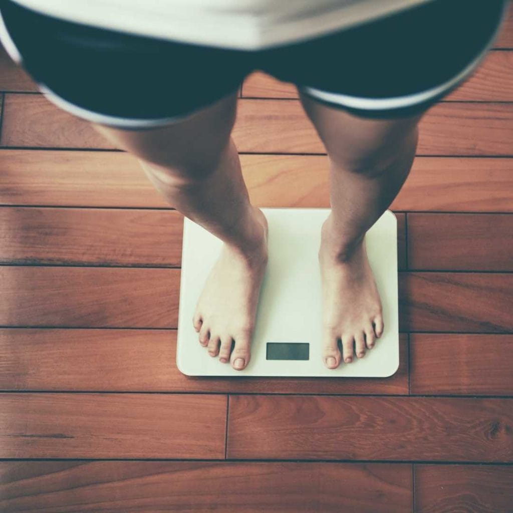 person standing on a scale