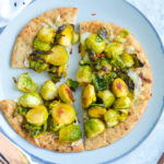 Brussels Sprouts Flatbread on whole wheat naan with mozzarella cheese