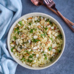 couscous with zaatar vinaigrette in white bowl with silverware