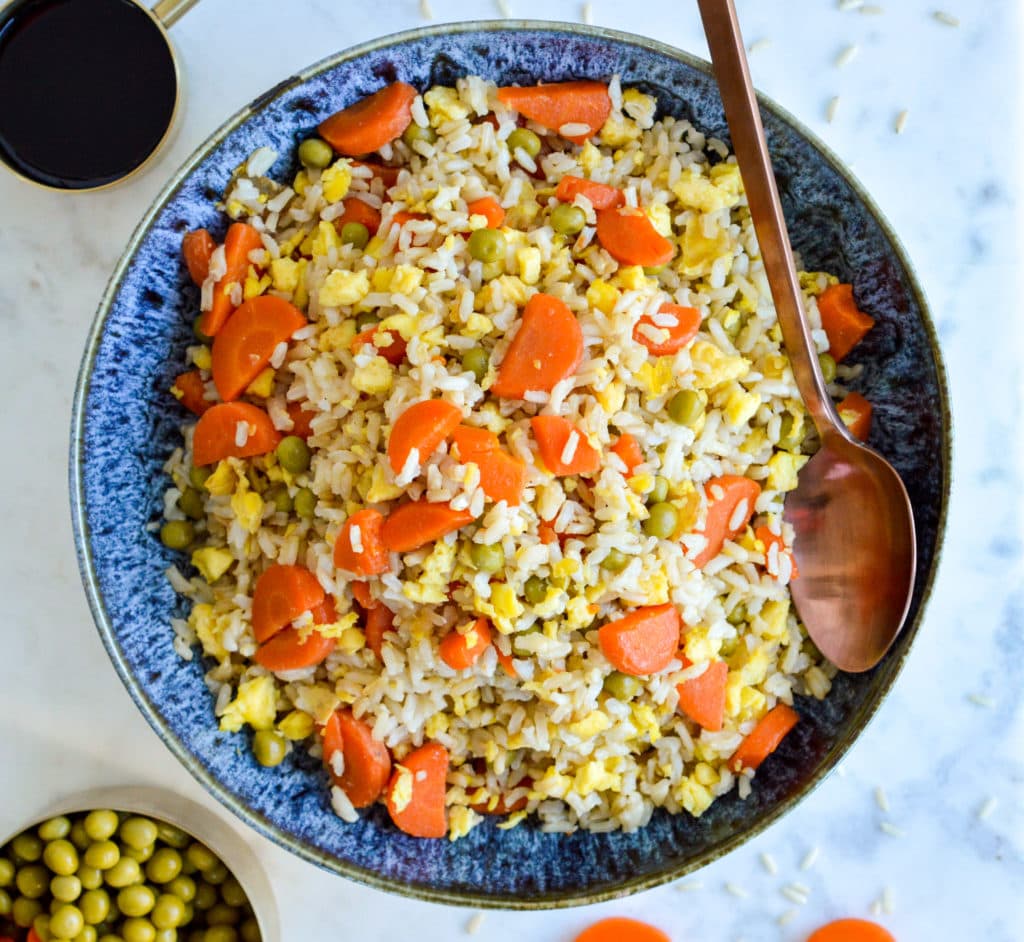 This Coconut Fried Rice is a healthier, easier and more affordable version of a take-out classic. Find out the SECRET ingredients that make this so simple to make!
