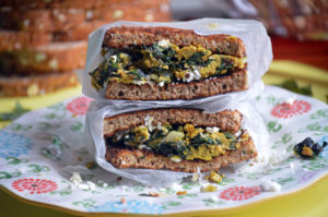 Turmeric Egg Sandwich with Swiss Chard & Feta on Dave's Killer Bread